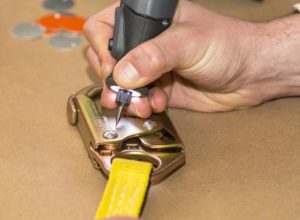 Hand labeling a piece of equipment.