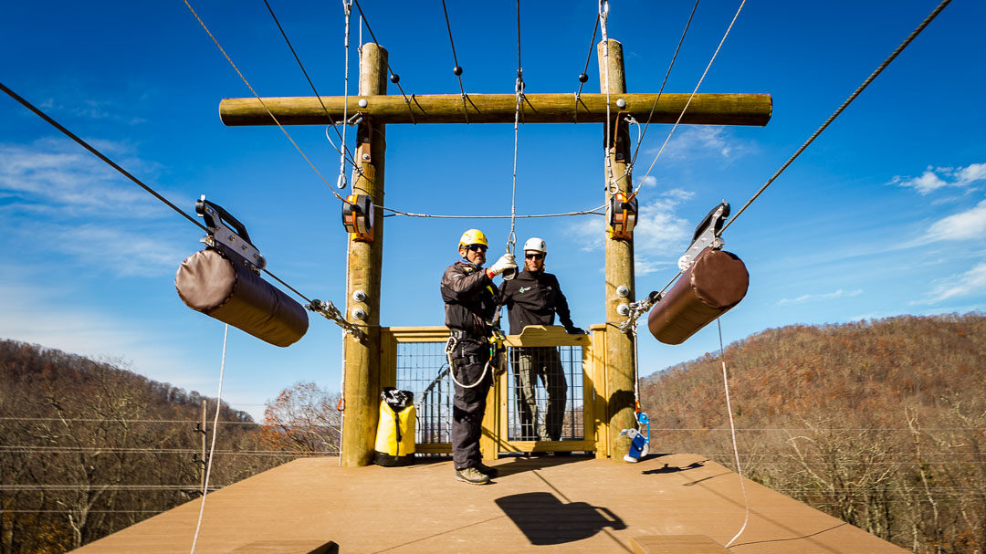 two men on a zipline platform - challenge course manager training