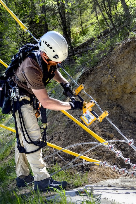 CT challenge course inspector checks guy cable tensions